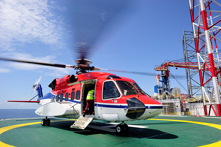 Offshore oil rig with helicopter